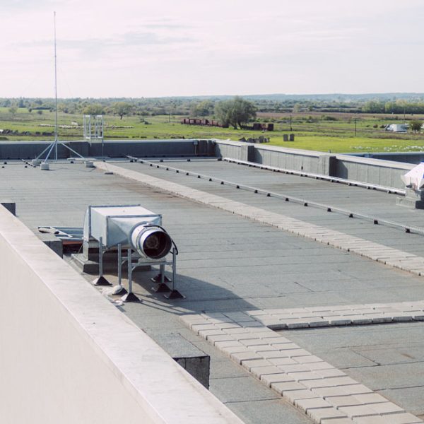 walkable terrace on the roof of the industrial hall is coated with a waterproofing material to protect the building from moisture damage.
